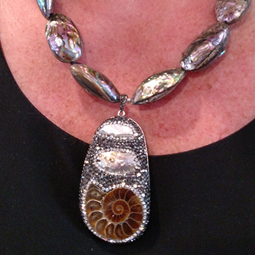 Vintage Celia Sebiri mother of pearl and onyx torsade with matching earrings.
